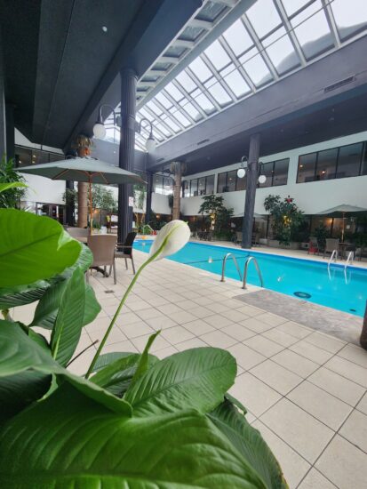 Heated indoor swimming pool at the hotel in Saguenay, perfect for relaxation and family fun.